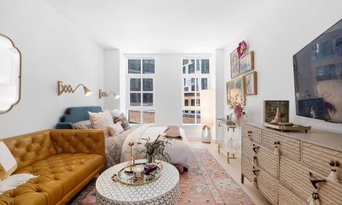 Living room with sofa and large windows 