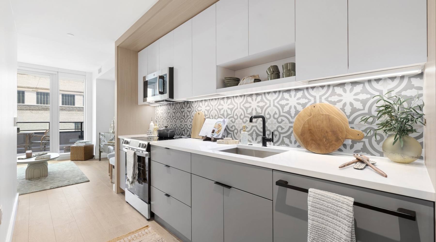 Settle into Comfort at Colette Co-Living Kitchen with decorative tile backsplash