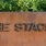 The Stacks sign on a planter