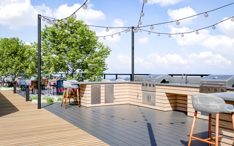 a deck with a wood deck and a wood deck with trees and blue sky