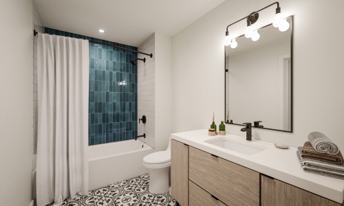 tile shower and flooring with oak cabinetry