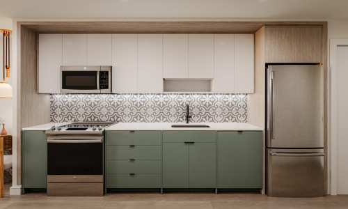 Kitchen with tile backsplash, stainless steel appliances, and under cabinet lighting