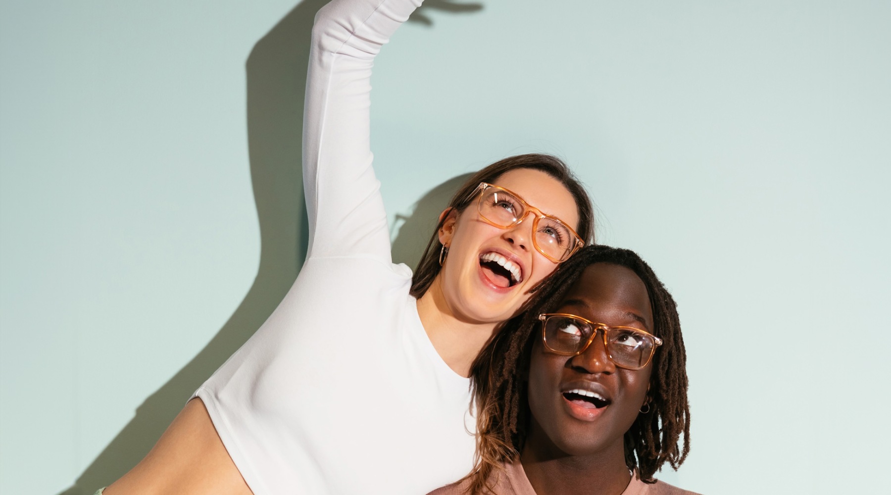 Home Is Where The Vibe Is two friends in a painted room